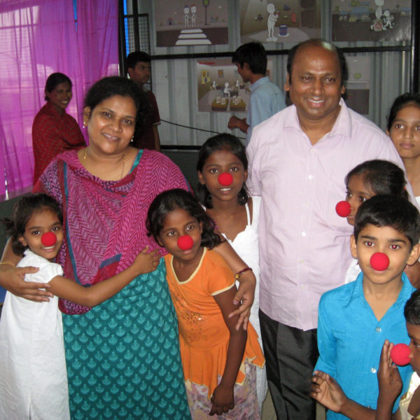 Shobha and Uttam clowning with kids