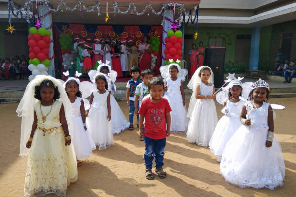 Children dance during their Christmas celebration at Bethel Orphanage