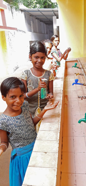 Girls from Mary Immaculate wash with soap.