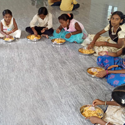 Children eating on the floor