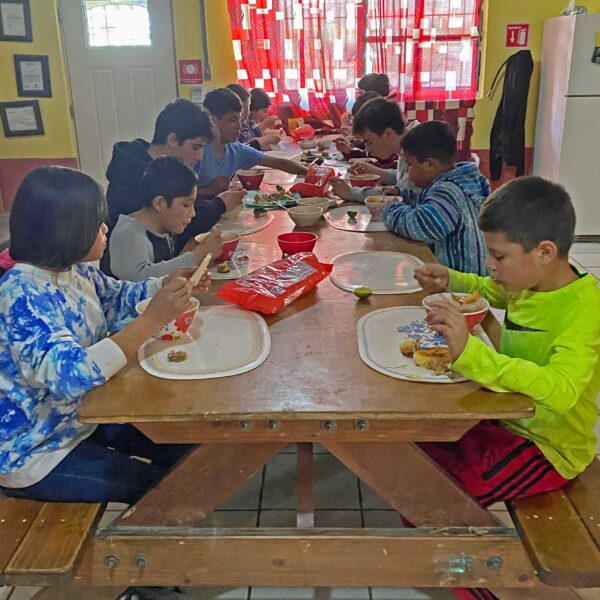 Casa Hogar children eat their lunch